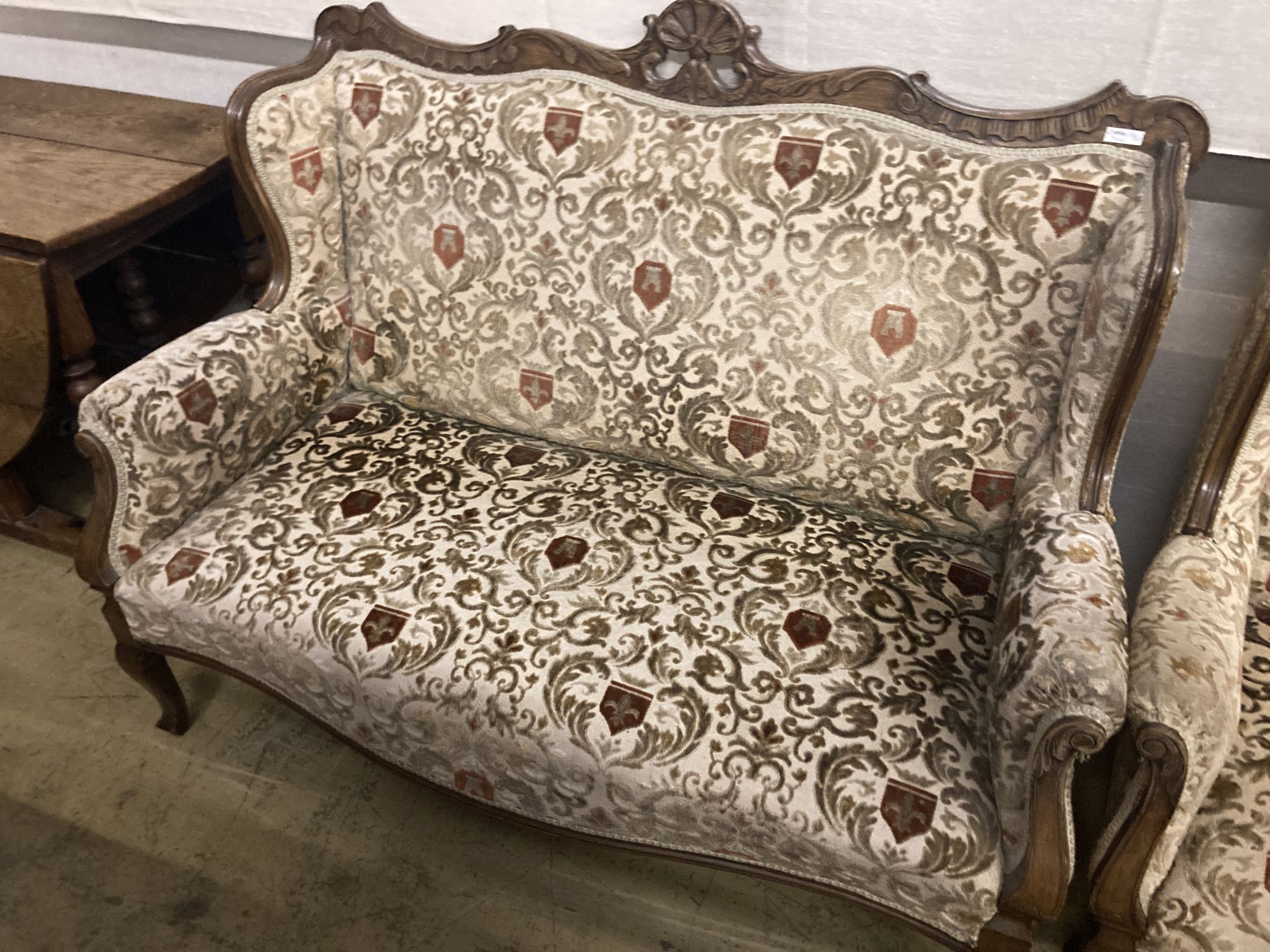 A late Victorian upholstered beech settee and armchair, settee width 130cm depth 66cm height 100cm